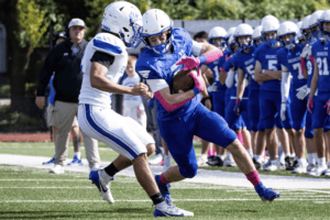 Davis Patterson breaks a tackle against Hendrick Hudson on Oct. 13. The Broncos beat the Sailors 47-0.